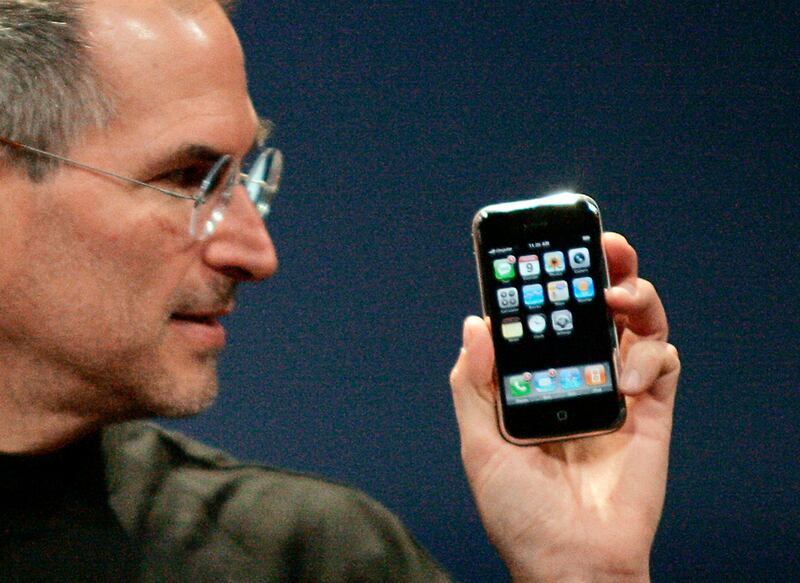 Apple's Steve Jobs with the new iPhone in January, 2007. The iPod mobile phone had a touch-screen, eight gigabytes of memory and cost $599. Reuters