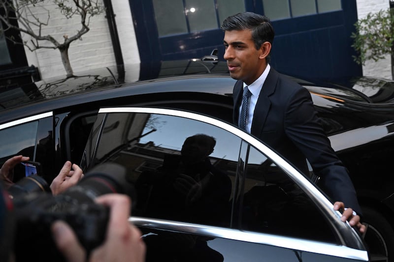 Mr Sunak leaves his home in London on Monday morning. AFP