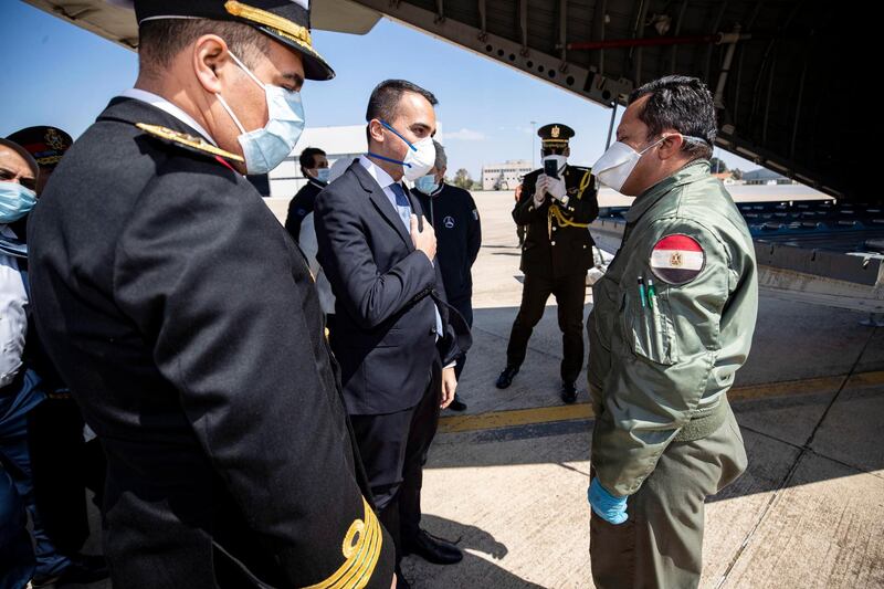 Airport staff unload medical aid sent to Italy from Egypt near Rome. EPA