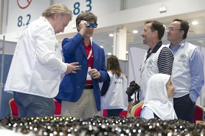 ABU DHABI, UNITED ARAB EMIRATES - MARCH 18, 2018.
Tim Shriver,  center, Chairman of the Special Olympics at the Healthy Athletes eye test center at IX MENA Special Olympic games held at Abu Dhabi National Exhibition Center.

The Healthy Athletes program provides free health screenings for 1,500 people with intellectual and physical challenges during the games. 

(Photo: Reem Mohammed/ The National)

Reporter:  Shireena Al Nuwais
Section:  SP