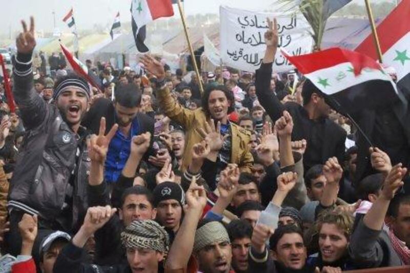 Sunni Muslim protesters take part in a demonstration in Ramadi, west of Baghdad. Opponents of Iraqi PM Nuri Al Maliki want to call him to parliament for questioning in a second attempt to force a vote of no confidence.