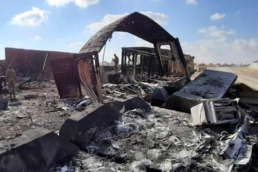 US soldiers on 14 January 2020 observe the damage caused days earlier by the Iranian missile attack on Ain Al Assad airbase in Anbar province, Iraq. EPA/STR