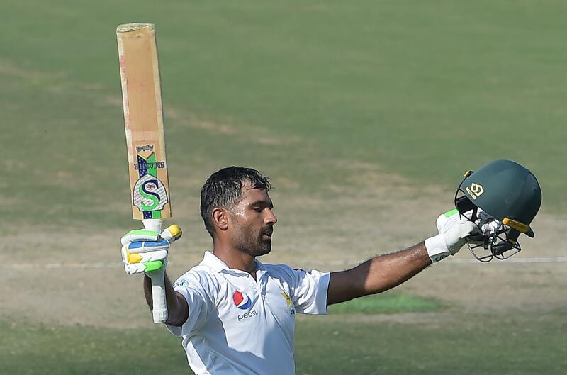 Pakistani batsman Asad Shafiq celebrates after scoring a century (100 runs) during the third day of the third and final Test cricket match between Pakistan and New Zealand at the Sheikh Zayed International Cricket Stadium in Abu Dhabi on December 5, 2018. / AFP / AAMIR QURESHI
