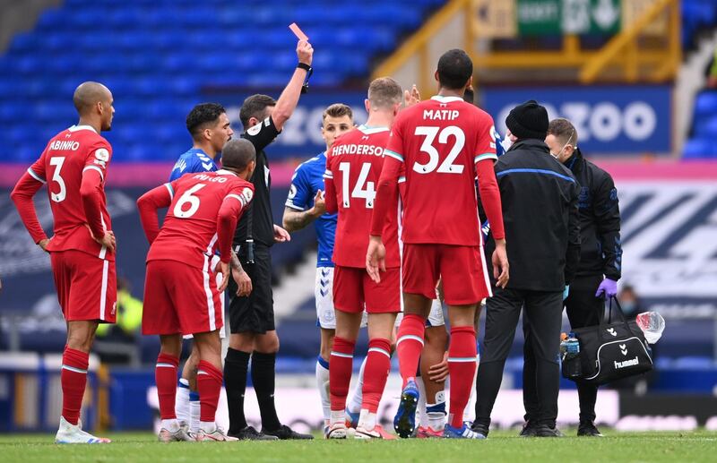 Everton's Richarlison is shown a red card by referee Michael Oliver for his challenge on Thiago Alcantara. Reuters