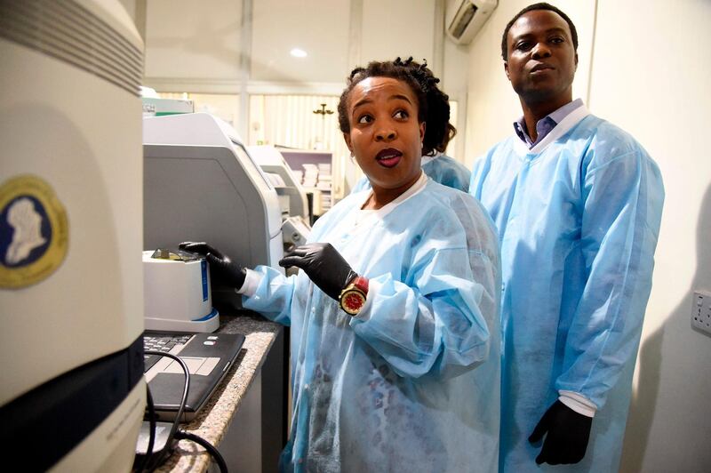 The African Centre of Excellence for Genomics of Infectious Diseases (ACEGID) laboratory manager, Philomena Eromon, left, and colleague molecular biologists analyse Covid-19 samples in the laboratory located at the Redeemer’s University in Ede. AFP