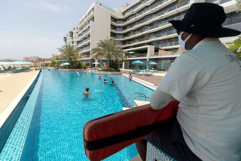 Dubai, United Arab Emirates - Reporter: N/A. News. Covid-19/Coronavirus. Summer heat. Swimming. Guests enjoy the pool at the The Retreat hotel. Sunday, July 26th, 2020. Dubai. Chris Whiteoak / The National