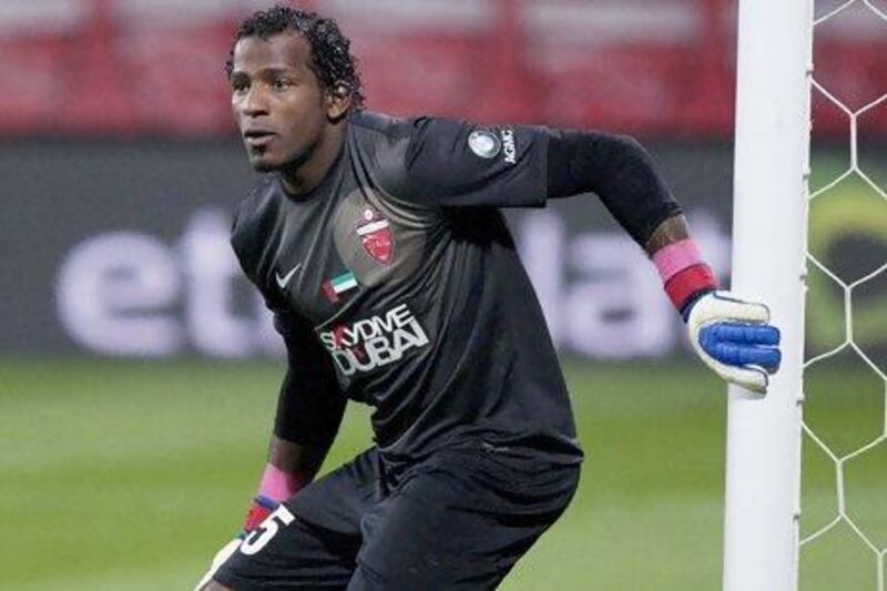 Dubai, United Arab Emirates, Jan 4 2013, Etisalat Cup football, 8pm, Rashid Stadium, Abu Dhabi, Al Ahli v Al Shabab- (centre in Blk) Al Ahli's #55 GK Majed Naser blocked the ball three times in one attack in the second half action and denide the Al Shabab to find the back of the net during action in the Etisalat Cup at Rashid Stadium,Dubai. Mike Young / The National?