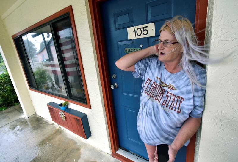 Rachel Ellison stands in the doorway to her apartment at the Lighthouse Motel, where she planned to ride out Hurricane Michael, in Panacea. Reuters