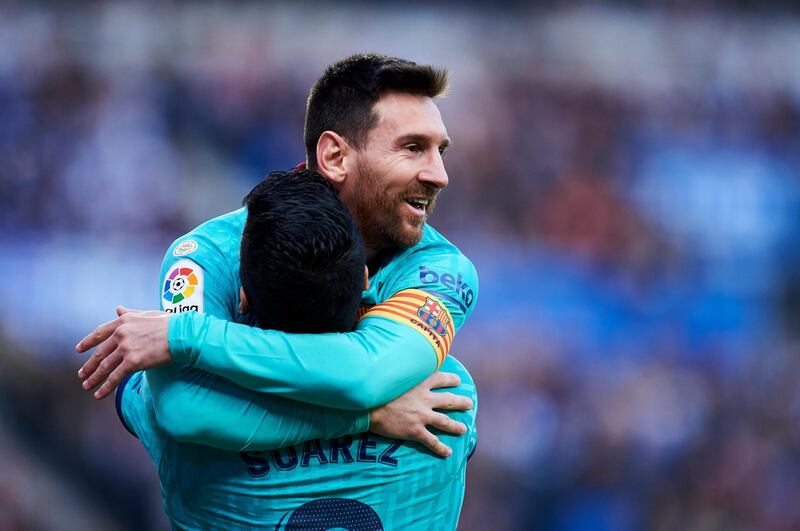Luis Suarez celebrates with teammate Lionel Messi after scoring Barcelona's second goal in San Sebastian. Getty Images