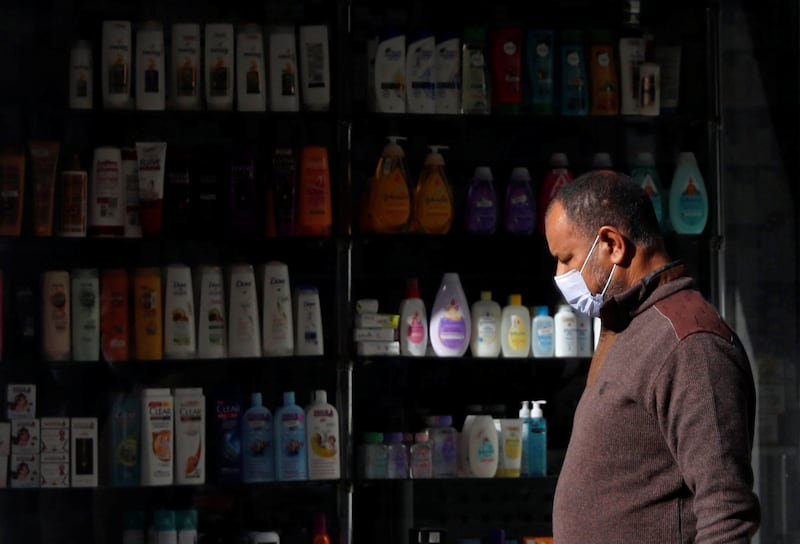 A man walks in front of a pharmacy amid the coronavirus disease (COVID-19) pandemic in Alexandria, Egypt December 6, 2020. REUTERS/Amr Abdallah Dalsh