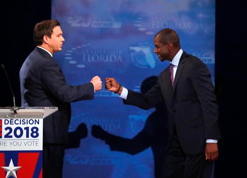 Florida gubernatorial candidates, Republican Ron DeSantis, left, and Democrat Andrew Gillum fist bump after a debate at Broward College in Davie, Florida.  AP Photo