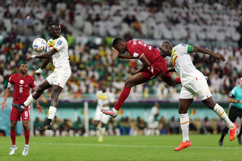 Mohammed Muntari heads home for Qatar to make it 2-1. Getty