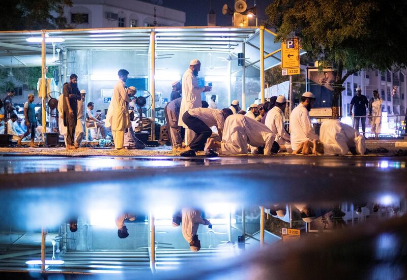 DUBAI, UNITED ARAB EMIRATES - May 17 2019.

Men prepare for taraweeh prayer at the Steel mosque on a rainy evening in Dubai .

(Photo by Reem Mohammed/The National)

Reporter: 
Section: NA