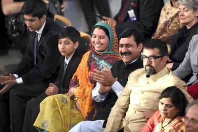 (LtoR) Nobel Peace Prize laureate Malala Yousafzai's brothers Khushal Khan, and Apal Khan, mother Toorpekai Yousufzai and father Ziauddin Yousufzai and co-laureate Kailash Satyarthi's son Bahawan react during the Nobel Peace Prize awarding ceremony at the City Hall in Oslo on December 10, 2014. The 17-year-old Pakistani girls' education activist Malala Yousafzai known as Malala shares the 2014 peace prize with the Indian campaigner Kailash Satyarthi, 60, who has fought for 35 years to free thousands of children from virtual slave labour.
AFP PHOTO / ODD ANDERSEN (Photo by ODD ANDERSEN / AFP)