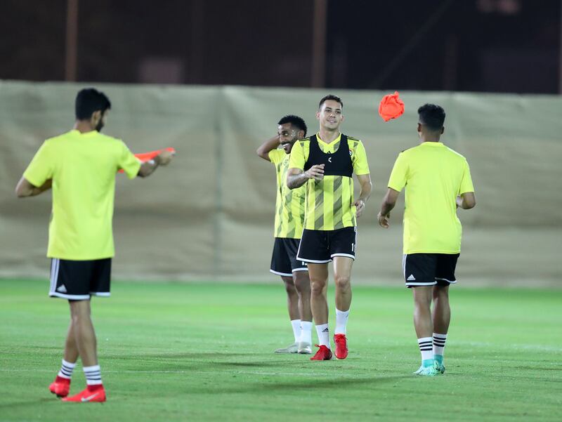 UAE's Caio Canedo throws a bib during the team's training session in Dubai. Chris Whiteoak / The National