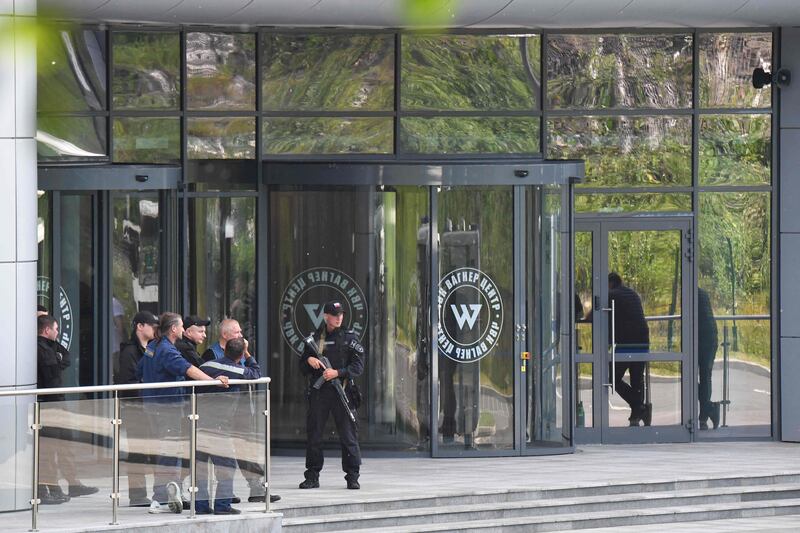 Russian police officers guard the Wagner group's headquarters in Saint Petersburg, after President Vladmir Putin described the actions by the mercenary forces as treason. AFP