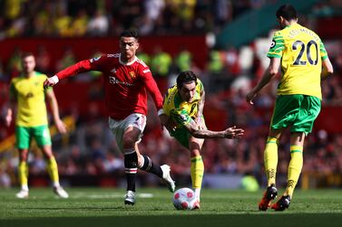 MANCHESTER, ENGLAND - APRIL 16: Cristiano Ronaldo of Manchester United battles for possession with Mathias Normann of Norwich City during the Premier League match between Manchester United and Norwich City at Old Trafford on April 16, 2022 in Manchester, England. (Photo by Naomi Baker / Getty Images)