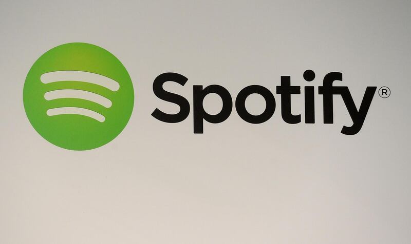 (FILES) In this file photo taken on December 11, 2013 a Spotify logo is seen during a press conference in New York.
Major music label Warner said August 7, 2018 it would give back $126 million to artists after it sold its stake in streaming leader Spotify.The Warner Music Group said the share sale from Spotify, which successfully listed on the New York Stock Exchange earlier this year, earned the company $504 million, or $317 million after paying taxes.  / AFP PHOTO / Emmanuel DUNAND