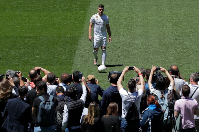 Real Madrid fans take pictures of new sining Luka Jovic. AP Photo