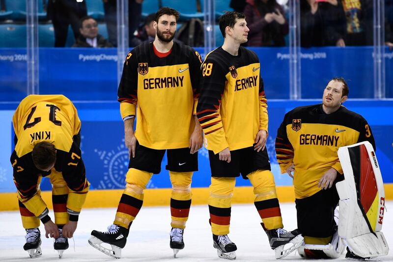Germany's players wait to receive their silver medals after the men's gold medal ice hockey match at the Pyeongchang 2018 Winter Olympic Games. Brendan Smialowski / AFP Photo