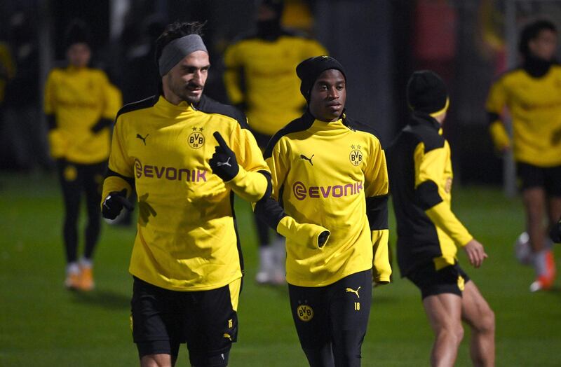 Dortmund's Mats Hummels and Youssoufa Moukoko. AFP