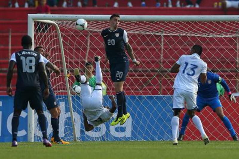 Juan Carlos Garcia scores for Honduras against the USA during their World Cup qualifier at Estadio Olimpico Metropolitano.