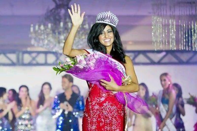 Pascal Abi-Samra, 24, of Pennsylvania, walks the stage after being crowned Miss Lebanon Emigrants USA 2012 in Dearborn, Michigan on Thursday.