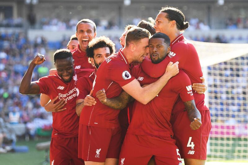 CARDIFF, WALES - APRIL 21: Georginio Wijnaldum of Liverpool is surrounded by team mates after scoring during the Premier League match between Cardiff City and Liverpool FC at Cardiff City Stadium on April 21, 2019 in Cardiff, United Kingdom. (Photo by Mike Hewitt/Getty Images)