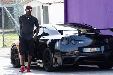 Italian striker Mario Balotelli arrives at the Castel Mella stadium in Brescia. Shutterstock