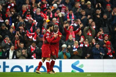 LIVERPOOL, ENGLAND - DECEMBER 10:  Mohamed Salah of Liverpool celebrates scoring the first Liverpool goal with Sadio Mane of Liverpool during the Premier League match between Liverpool and Everton at Anfield on December 10, 2017 in Liverpool, England.  (Photo by Clive Brunskill/Getty Images)