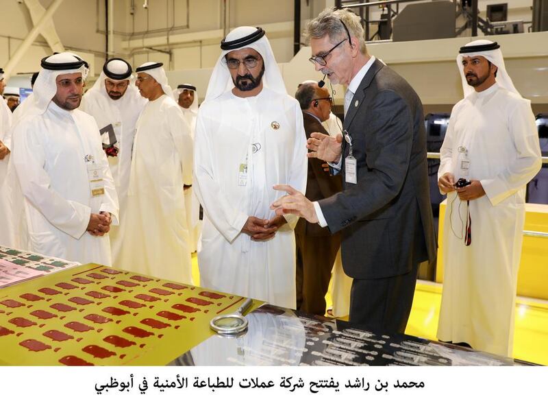 Sheikh Mohammed bin Rashid, Vice President and Ruler of Dubai, is briefed by the Governor of the UAE Central Bank Mubarak Rashed Al Mansoori about the facility’s production machinery. Wam