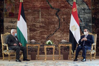 A handout picture provided by the Palestinian Authority's press office (PPO) on November 30, 2020 shows Palestinian president Mamhud Abbas (L) meeting with Egyptian President Abdel Fattah al-Sis at the presidential palace in Egypt's capital Cairo. AFP Photo / HO / PPO 