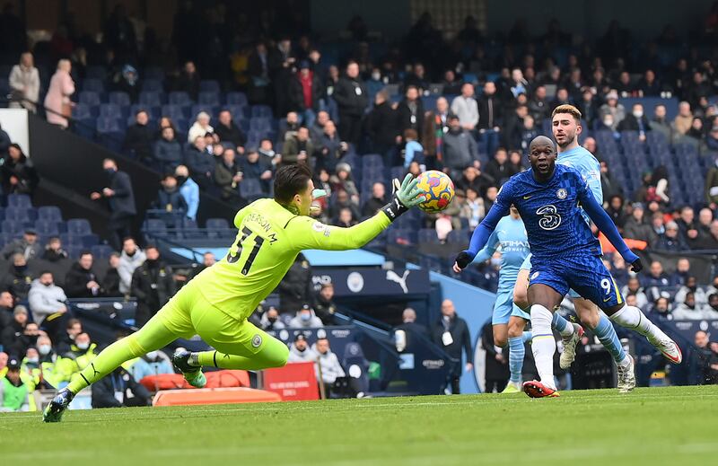 Manchester City goalkeeper Ederson makes a save from Romelu Lukaku. Getty Images