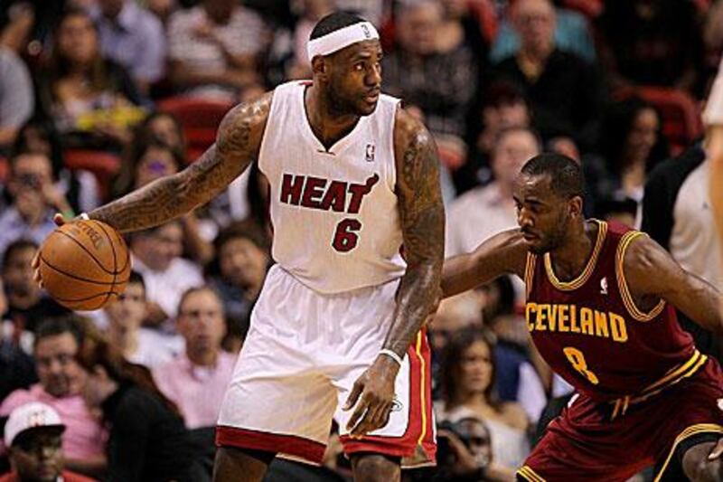 LeBron James, left, is not considering playing abroad and is optimistic the NBA will be saved this season.