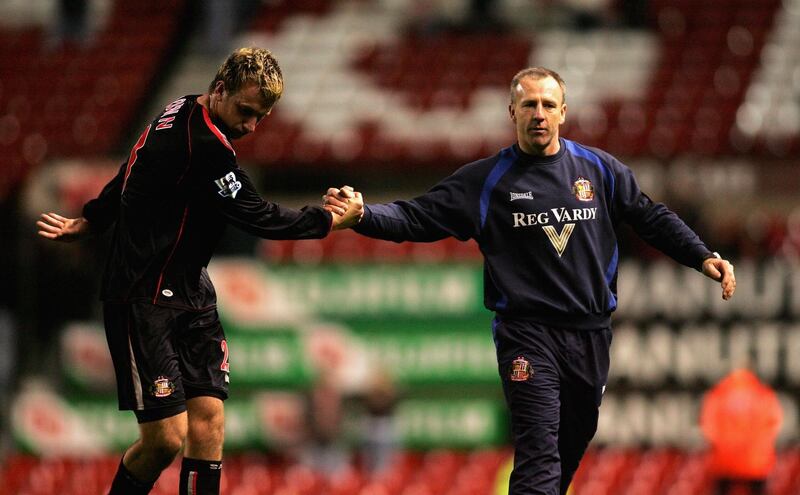 MANCHESTER, UNITED KINGDOM - APRIL 14: Caretaker manager of Sunderland Kevin Ball (R) shakes hands with Chris Brown of Sunderland after their side's goaless draw and relegation in the Barclays Premiership match between Manchester United and Sunderland at Old Trafford on April 14, 2006 in Manchester,England.  (Photo by Michael Steele/Getty Images)