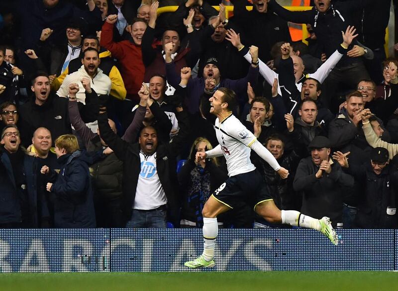 Tottenham Hotspur striker Roberto Soldado celebrates in front of supporters after scoring during the English Premier League match against Everton at White Hart Lane in north London on November 30, 2014. Ben Stansall / AFP