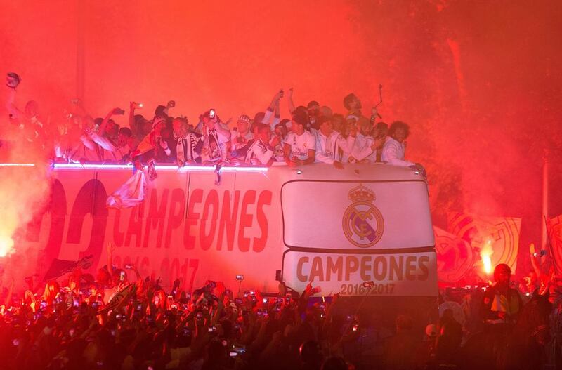 Real Madrid players arrive at Cibeles square after winning the Primera Liga title. Denis Doyle / Getty Images