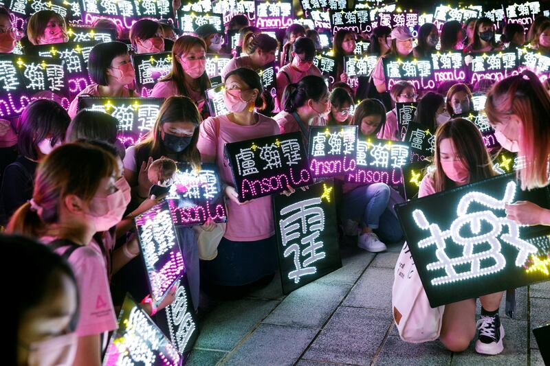 Fans of Anson Lo, a member of Cantopop boy band Mirror, pose for group photo before a concert in Hong Kong. Reuters