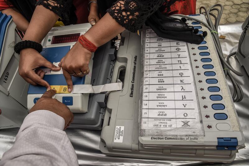 An Indian election worker learns how to operate voting machines at an Elections Commission facility before moving to a polling station in Noida, India. First phase of voting will start tomorow on 11 April. Around 900 million people will be casting their ballots during India's general election, which is scheduled from 11 April to 19 May and considered the world's biggest democratic exercise.  Getty Images