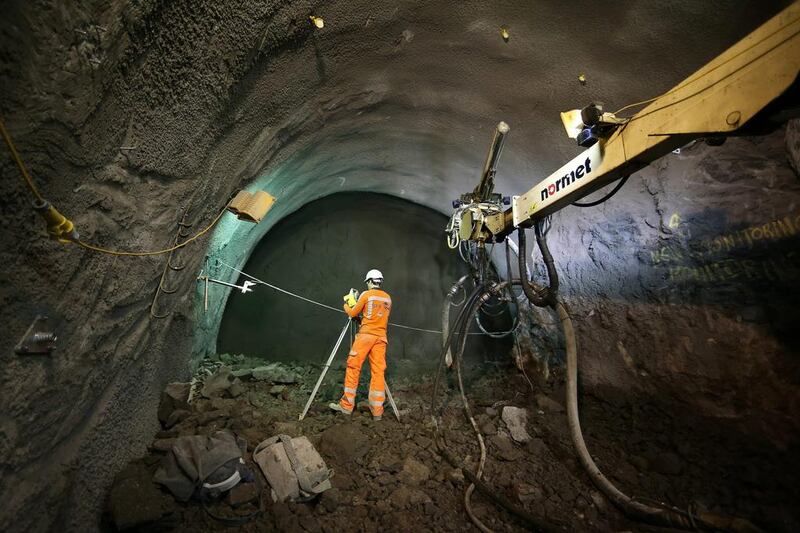 An engineer checks progress on a crossover rail tunnel. Peter Macdiarmid / Getty Images