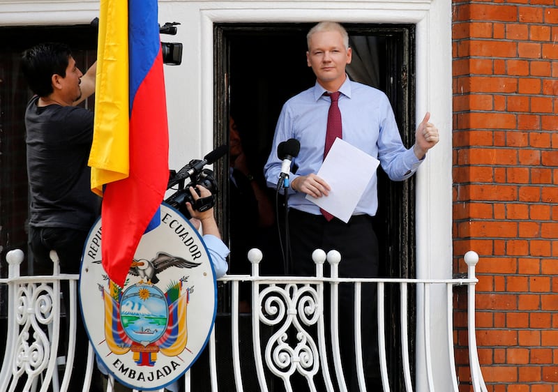 Mr Assange prepares to speak from the balcony of Ecuador's embassy in August 2012. Reuters