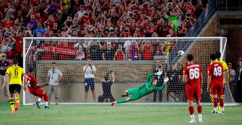 Rhian Brewster scores from the penalty spot for Liverpool in their 3-2 friendly loss to Borussia Dortmund. AFP