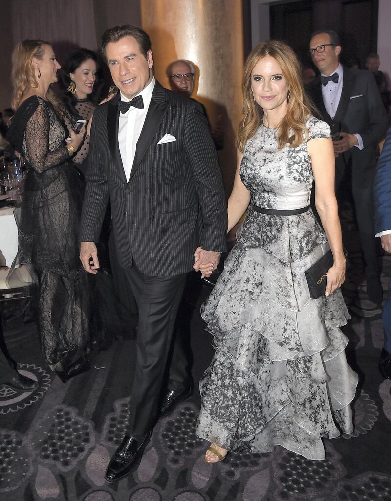 BEVERLY HILLS, CA - JANUARY 08: Actors (L-R) John Travolta and Kelly Preston attend the 74th Annual Golden Globe Awards at The Beverly Hilton Hotel on January 8, 2017 in Beverly Hills, California.   Kevin Winter/Getty Images/AFP