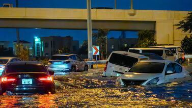 Cars drive in a flooded street following heavy rain in Dubai. In a claim involving natural calamity, the insurer has no recovery rights. AFP