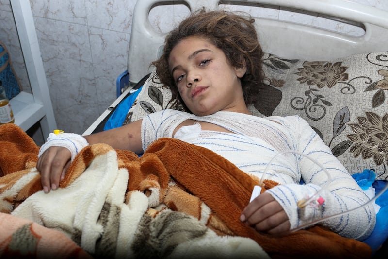 A victim lies in a hospital bed. Reuters