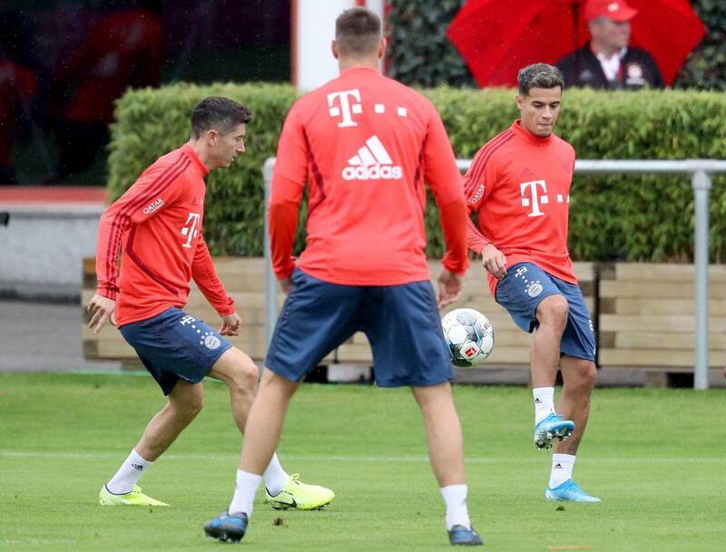 Coutinho plays the ball whilst Lewandowski and Niklas Suele look on. Getty Images