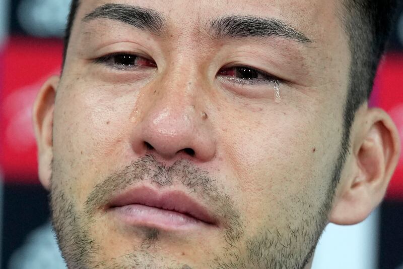Maya Yoshida sheds tears as he gives an interview a day after Japan's last-16 defeat by Croatia. AP 