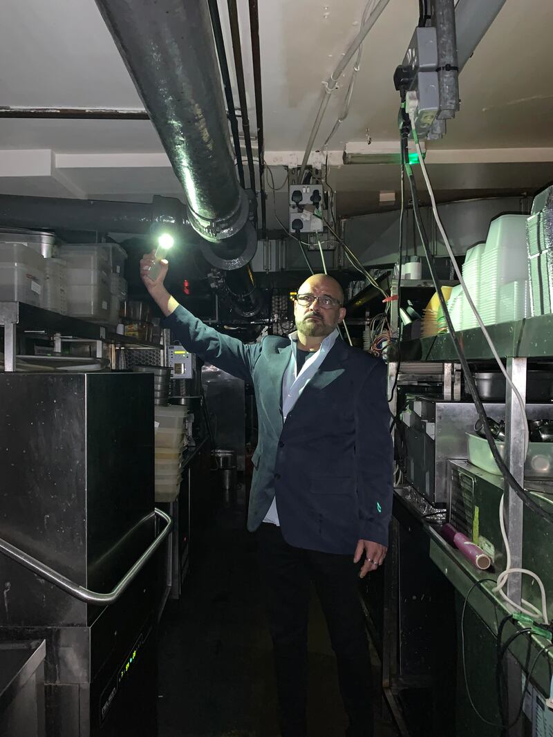 Al Basha head chef Elias Sawaya inspects the damage to his kitchen. Photo: Laura O'Callaghan / The National