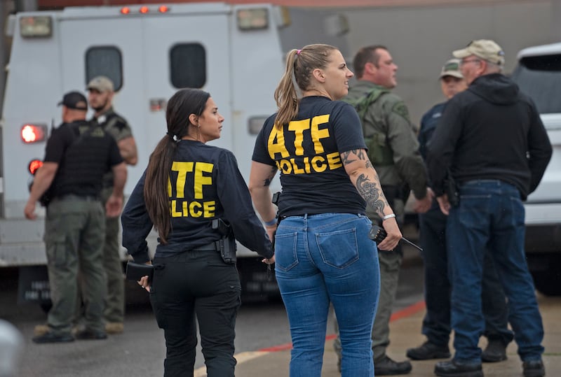 Officers from the Bureau of Alcohol, Tobacco, Firearms and Explosives, better known as ATF, arrive at the scene of the shooting. AP