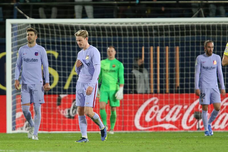 Barcelona's Gerard Pique, left and Frenkie de Jong react after Villarreal score. AP Photo